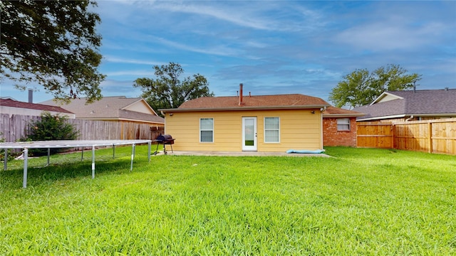2010 Wildwood Dr, Deer Park, TX 77536 - back of property with a trampoline and a fenced backyard