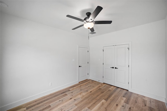 19219 Hikers Trail Dr, Humble, TX 77346 - unfurnished bedroom featuring light wood-style floors, a closet, and ceiling fan