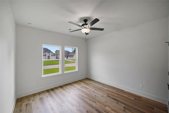 19219 Hikers Trail Dr, Humble, TX 77346 - spare room with wood finished floors, ceiling fan, and a smoke detector