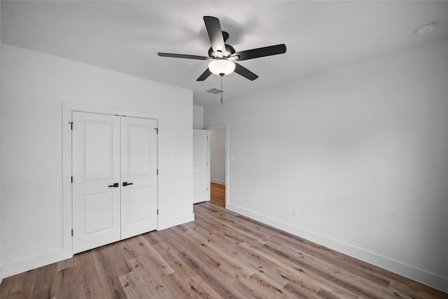 19219 Hikers Trail Dr, Humble, TX 77346 - unfurnished bedroom with light wood-type flooring, a closet, and ceiling fan