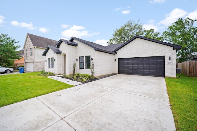 19219 Hikers Trail Dr, Humble, TX 77346 - view of front of home with brick siding, an attached garage, and concrete driveway