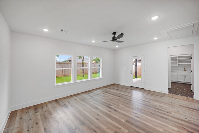 19219 Hikers Trail Dr, Humble, TX 77346 - unfurnished bedroom with attic access, light wood-style floors, recessed lighting, ensuite bathroom, and ceiling fan