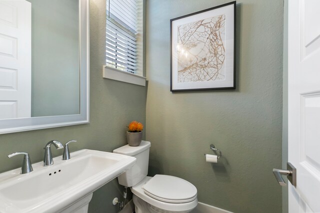 152 E Shell Port Sq, The Woodlands, TX 77380 - half bathroom featuring a sink and toilet