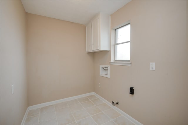 13903 Chevy Chase Dr, Houston, TX 77077 - laundry room with washer hookup, cabinet space, hookup for a gas dryer, and light tile patterned floors