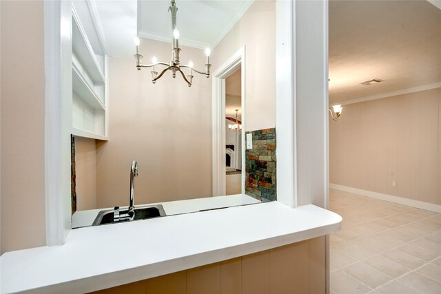 13903 Chevy Chase Dr, Houston, TX 77077 - bar area featuring ornamental molding, a chandelier, decorative light fixtures, and light tile patterned flooring