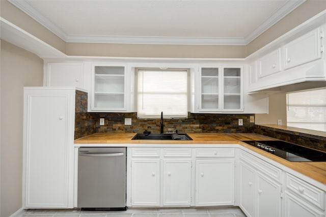 13903 Chevy Chase Dr, Houston, TX 77077 - kitchen with stainless steel dishwasher, black electric stovetop, ornamental molding, plenty of natural light, and decorative backsplash