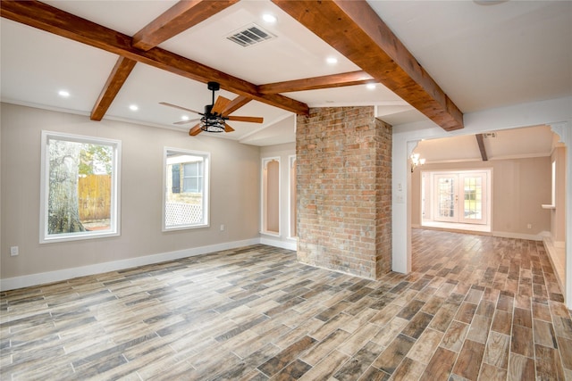13903 Chevy Chase Dr, Houston, TX 77077 - unfurnished living room featuring healthy amount of natural light, wood finished floors, a ceiling fan, and a chandelier