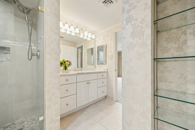 5001 Woodway Dr Unit 1701, Houston, TX 77056 - full bathroom featuring a shower stall, crown molding, vanity, tile patterned floors, and wallpapered walls