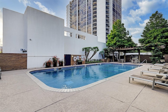 5001 Woodway Dr Unit 1701, Houston, TX 77056 - community pool featuring a pergola and a patio