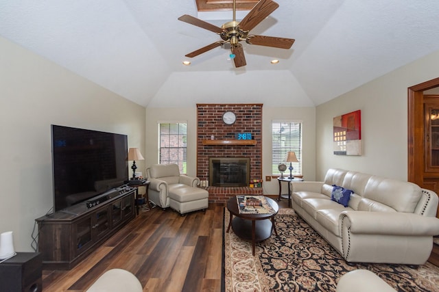 3701 Regency Dr, Deer Park, TX 77536 - living area featuring dark wood finished floors, plenty of natural light, lofted ceiling, ceiling fan, and a brick fireplace