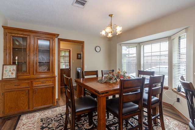 3701 Regency Dr, Deer Park, TX 77536 - dining area with a chandelier and light wood-style floors