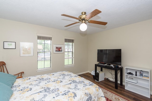 3701 Regency Dr, Deer Park, TX 77536 - bedroom with dark wood-style flooring and a ceiling fan