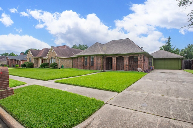 3701 Regency Dr, Deer Park, TX 77536 - view of front facade with a front lawn, brick siding, driveway, and a shingled roof