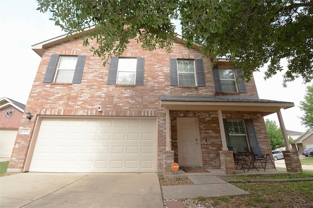 3619 Robwood Ct, Katy, TX 77449 - view of front of property featuring brick siding, driveway, a garage, and a porch