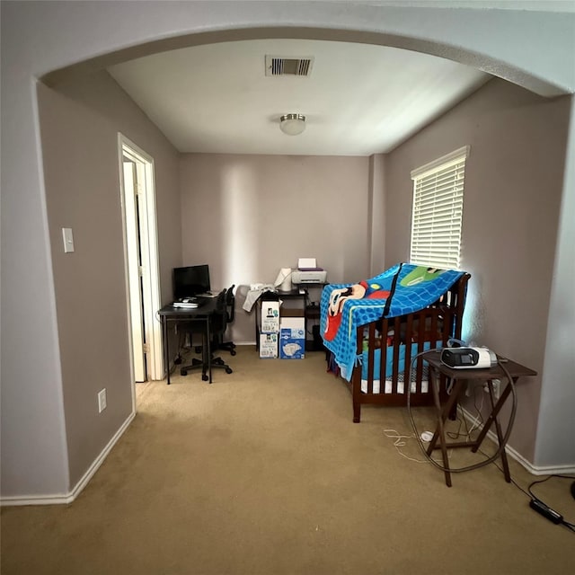 3619 Robwood Ct, Katy, TX 77449 - bedroom with arched walkways, carpet flooring, and an office area