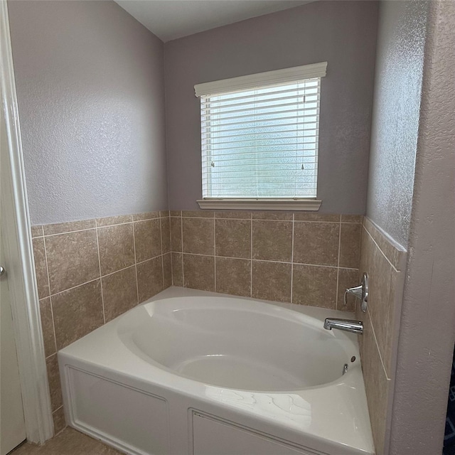 3619 Robwood Ct, Katy, TX 77449 - bathroom with a garden tub and a textured wall
