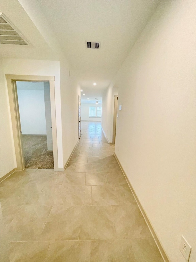 4107 Yosemite Valley Ct, Katy, TX 77494 - hallway with light tile patterned floors and baseboards