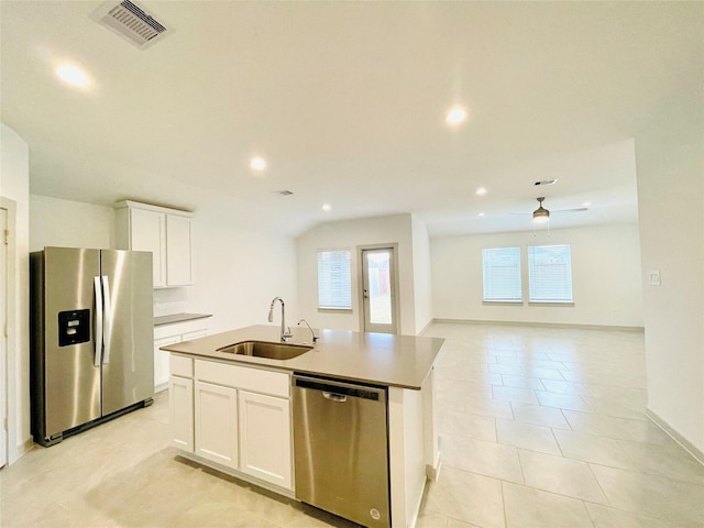 4107 Yosemite Valley Ct, Katy, TX 77494 - kitchen featuring appliances with stainless steel finishes, white cabinetry, recessed lighting, a center island with sink, and light tile patterned flooring