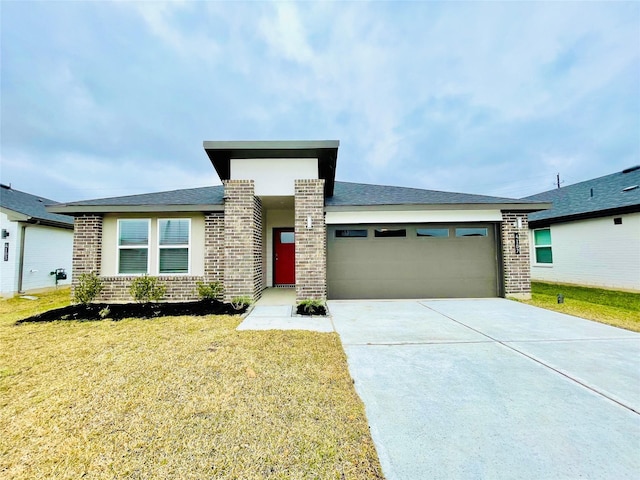 4107 Yosemite Valley Ct, Katy, TX 77494 - view of front facade featuring brick siding, an attached garage, a front yard, and driveway