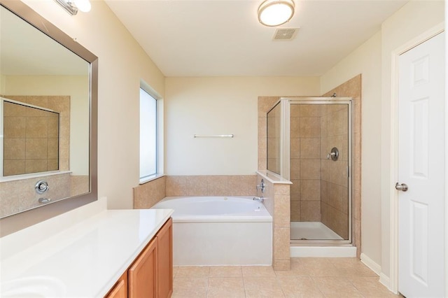 15807 Sarasam Creek Ct, Cypress, TX 77429 - full bath with vanity, a bath, tile patterned floors, and a shower stall