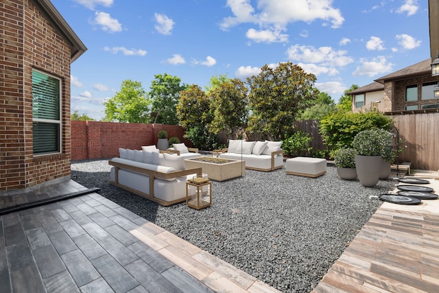 6510 Brady Springs Ct, Sugar Land, TX 77479 - fenced backyard featuring an outdoor living space with a fire pit and a patio area