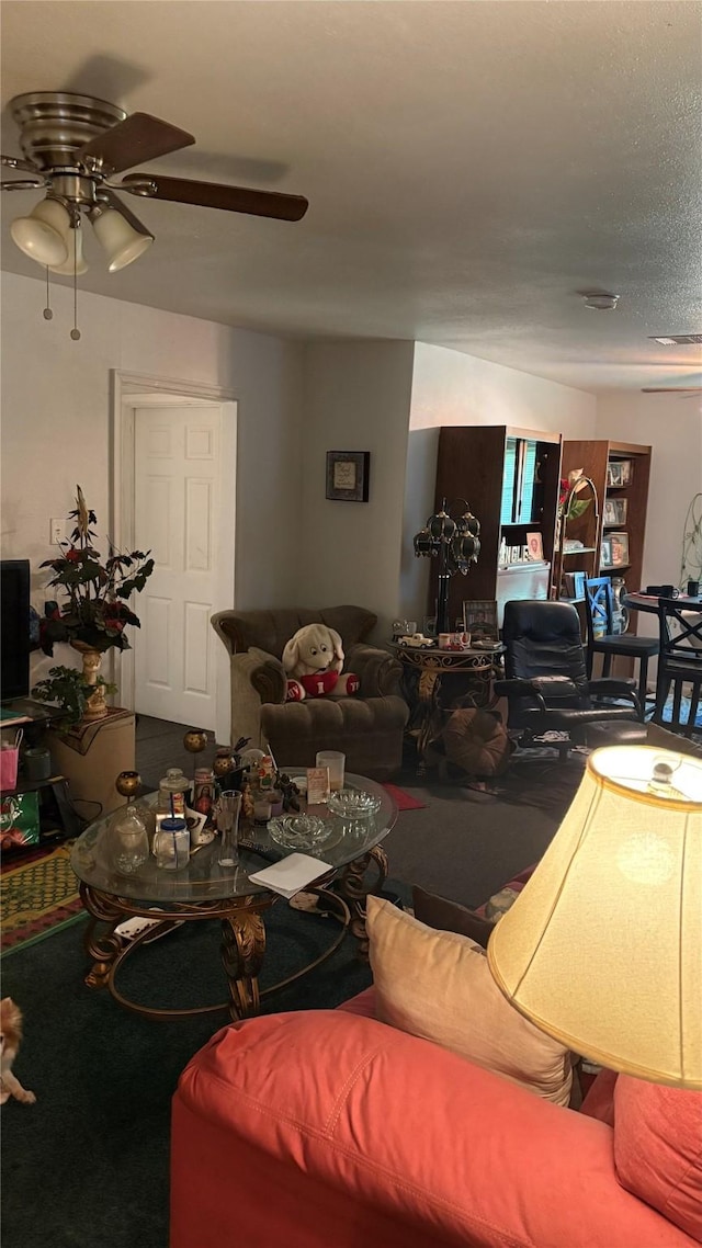 5510 Chennault Rd, Houston, TX 77033 - living room featuring ceiling fan and carpet floors