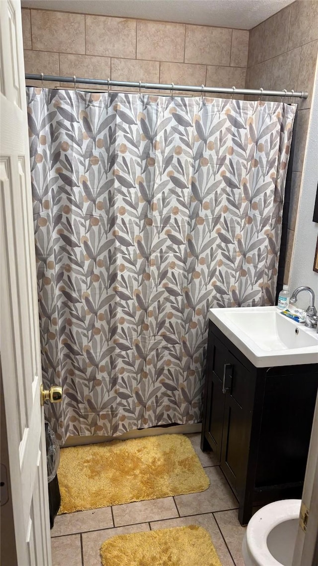 5510 Chennault Rd, Houston, TX 77033 - full bath featuring vanity, curtained shower, and tile patterned flooring