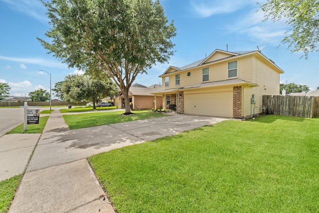1022 Vera Cruz Dr, Rosenberg, TX 77471 - traditional-style house featuring a garage, brick siding, and concrete driveway