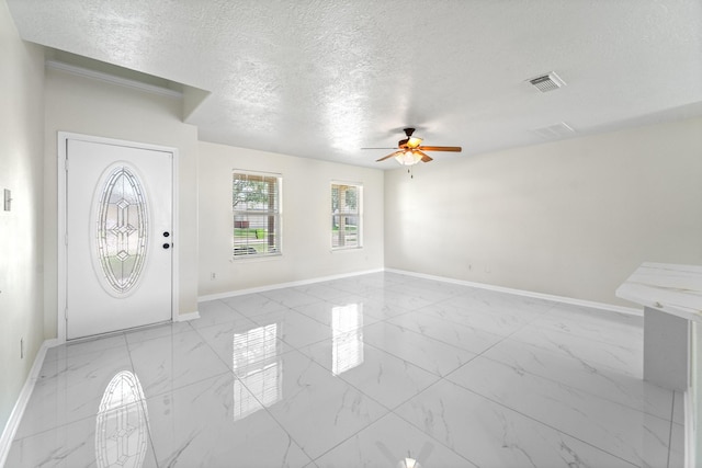 1022 Vera Cruz Dr, Rosenberg, TX 77471 - entrance foyer featuring light marble finish flooring, a ceiling fan, and a textured ceiling