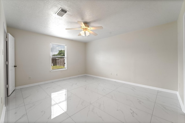 1022 Vera Cruz Dr, Rosenberg, TX 77471 - unfurnished room with light marble finish floors, ceiling fan, and a textured ceiling