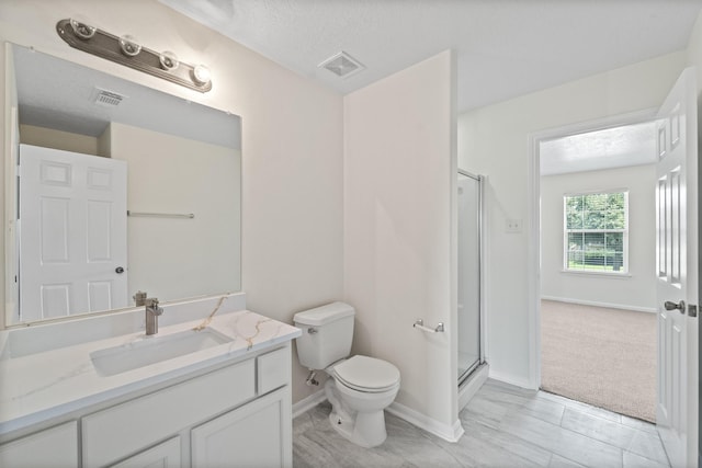 1022 Vera Cruz Dr, Rosenberg, TX 77471 - bathroom with vanity, a shower with shower door, and a textured ceiling