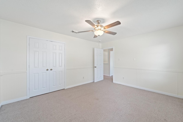 1022 Vera Cruz Dr, Rosenberg, TX 77471 - unfurnished bedroom featuring carpet floors, a closet, and ceiling fan