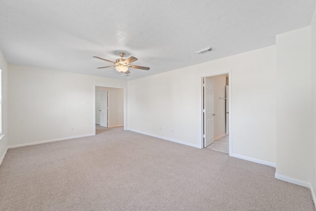 1022 Vera Cruz Dr, Rosenberg, TX 77471 - spare room with a ceiling fan and light colored carpet