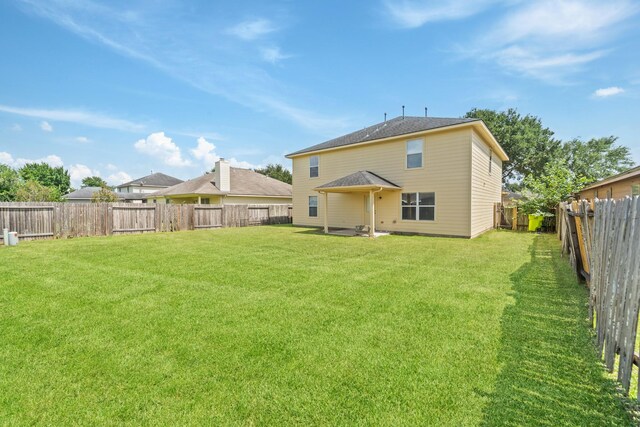 1022 Vera Cruz Dr, Rosenberg, TX 77471 - back of house with a fenced backyard