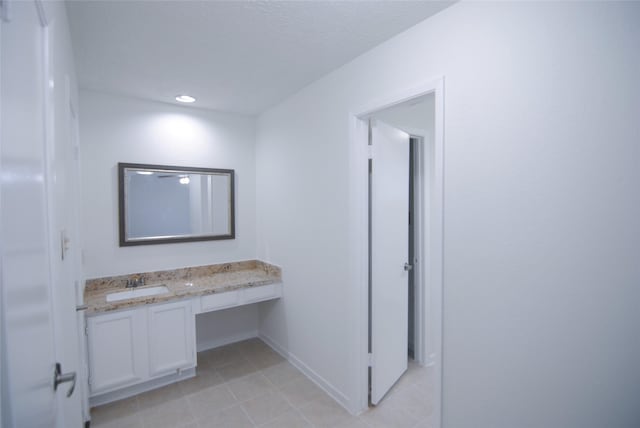6503 Gladewell Dr, Houston, TX 77072 - bathroom with tile patterned floors, vanity, and recessed lighting