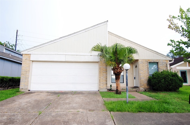 6503 Gladewell Dr, Houston, TX 77072 - view of front of house with driveway, a garage, and brick siding
