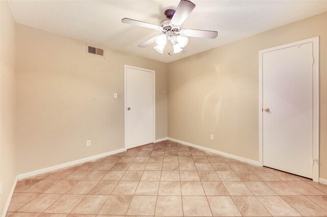 12550 Whittington Dr Unit 816, Houston, TX 77077 - unfurnished room with ceiling fan, a textured ceiling, and light tile patterned flooring