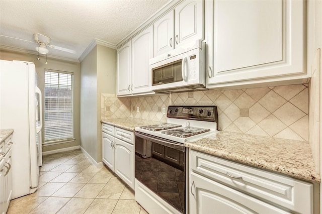 12550 Whittington Dr Unit 816, Houston, TX 77077 - kitchen with white appliances, crown molding, a textured ceiling, backsplash, and light stone countertops