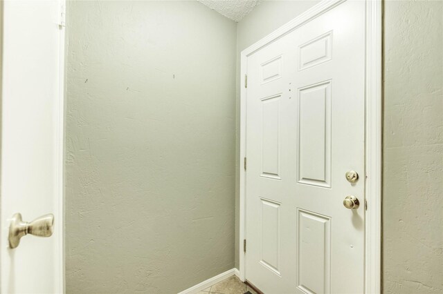 12550 Whittington Dr Unit 816, Houston, TX 77077 - entryway with tile patterned flooring and a textured ceiling