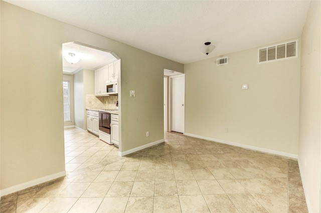 12550 Whittington Dr Unit 816, Houston, TX 77077 - unfurnished room featuring light tile patterned floors and arched walkways