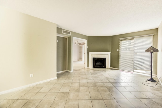 12550 Whittington Dr Unit 816, Houston, TX 77077 - unfurnished living room featuring a fireplace, light tile patterned floors, and a ceiling fan