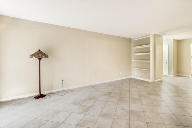 12550 Whittington Dr Unit 816, Houston, TX 77077 - empty room with light tile patterned floors and built in shelves