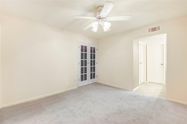12550 Whittington Dr Unit 816, Houston, TX 77077 - carpeted spare room featuring french doors, ceiling fan, and a textured ceiling