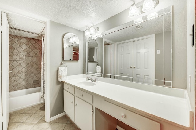 12550 Whittington Dr Unit 816, Houston, TX 77077 - bathroom featuring vanity, tile patterned floors, shower / bath combo with shower curtain, and a textured ceiling