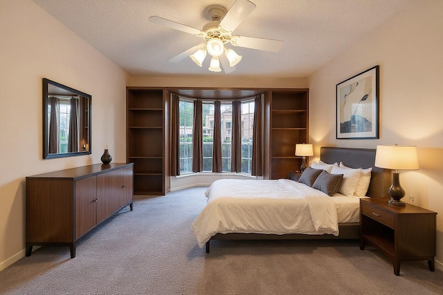 12550 Whittington Dr Unit 816, Houston, TX 77077 - bedroom with carpet floors, a textured ceiling, and a ceiling fan