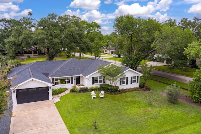 8932 Padfield St, Houston, TX 77055 - single story home with a front lawn, driveway, and an attached garage