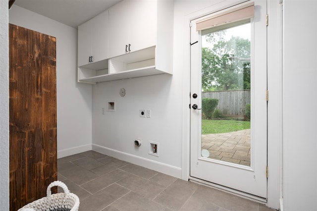 8932 Padfield St, Houston, TX 77055 - laundry area with electric dryer hookup, cabinet space, tile patterned flooring, washer hookup, and hookup for a gas dryer