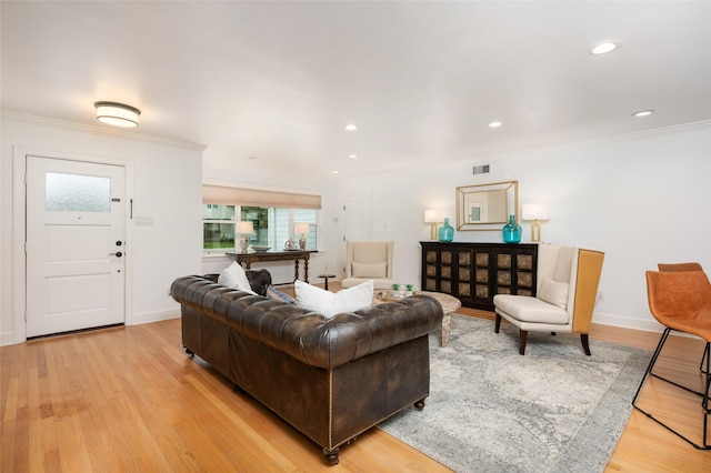 8932 Padfield St, Houston, TX 77055 - living area featuring ornamental molding, light wood-style floors, and recessed lighting