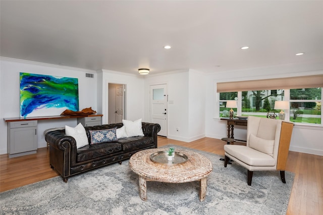8932 Padfield St, Houston, TX 77055 - living room with wood finished floors, ornamental molding, and recessed lighting