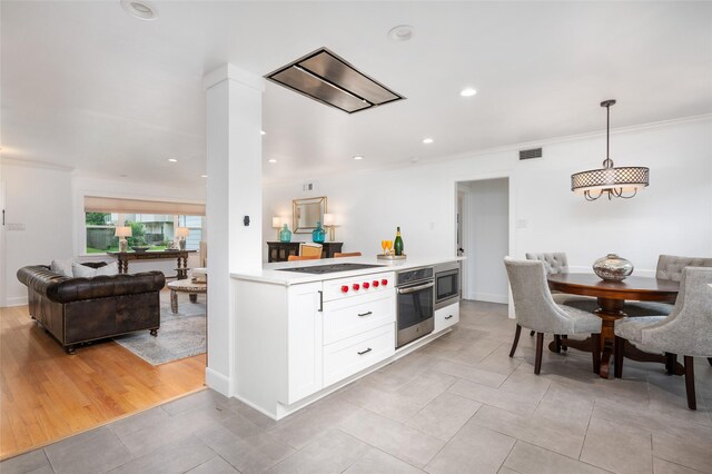 8932 Padfield St, Houston, TX 77055 - kitchen with appliances with stainless steel finishes, white cabinets, light tile patterned floors, light countertops, and crown molding